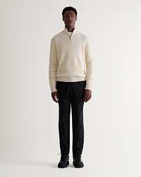 Image 1 of 6 showing man wearing Rise & Fall's Cashmere Merino Fishermans Rib 1/4 Zip Jumper in cream.