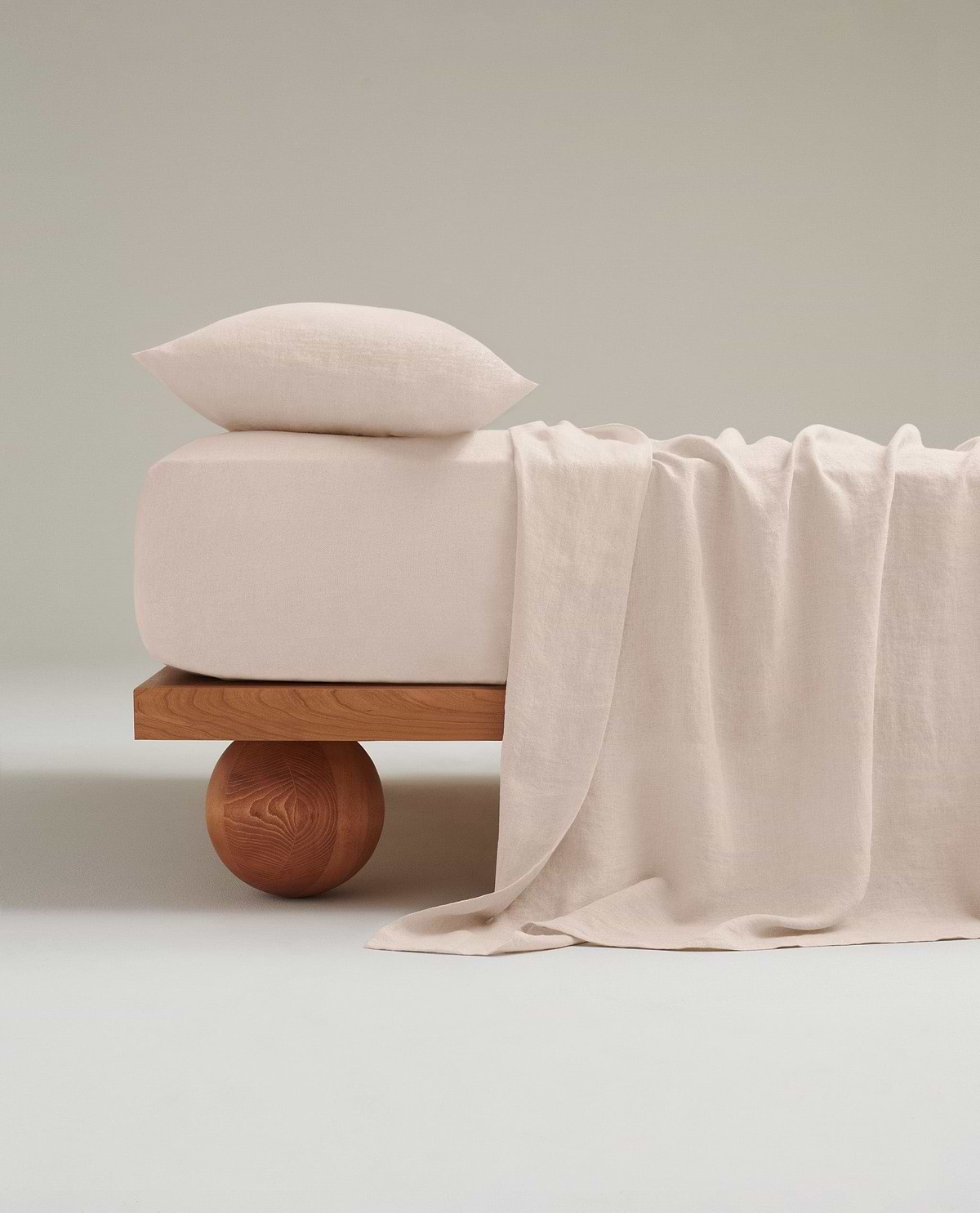 Image 1 of 6 showing Rise & Fall's Relaxed & Refined linen flat sheet in pale peach.