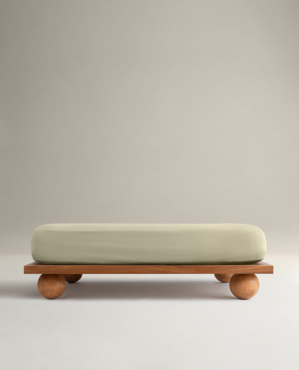 Image 1 of 6 showing Rise & Fall's Crisp & Cool organic cotton fitted bed sheet in sage.