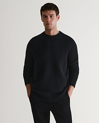 Image 1 of 7 showing man wearing Rise & Fall's Finest Cashmere Mid-Weight Crew Neck Jumper in black with tailored black trousers.
