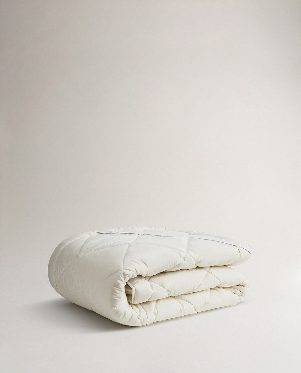 Image 2 of 2 showing Rise & Fall's  certified British Wool Mattress Topper.