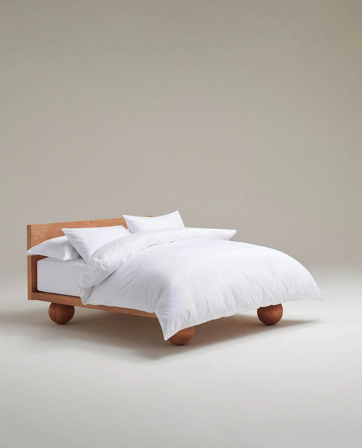 image 2 of 3 showing bed made with Rise & Fall's white crisp & cool duvet set in percale cotton