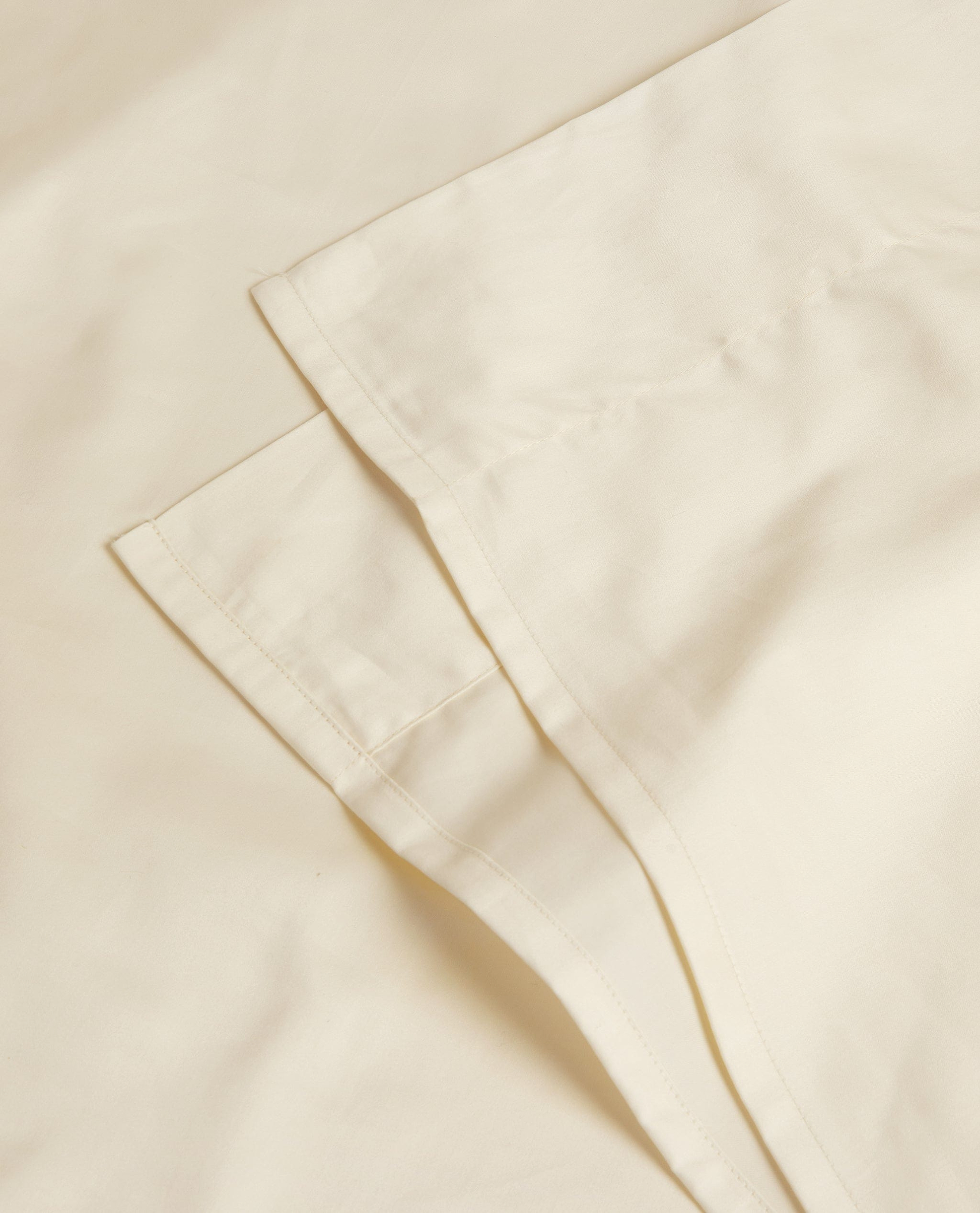 Image 2 of 3 showing Rise & Fall's Soft & Smooth sateen cotton flat sheet in buttermilk.