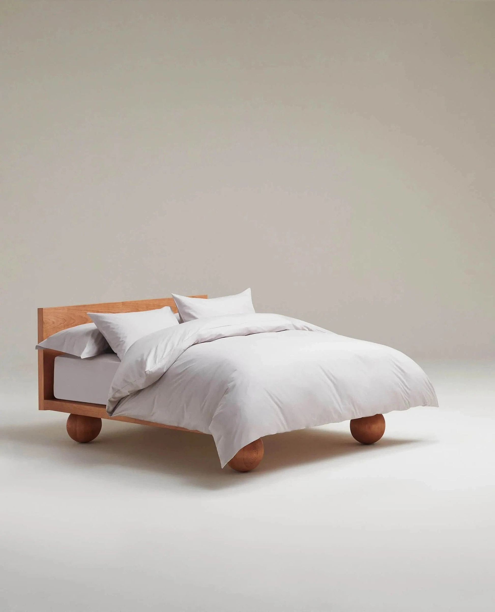 image 2 of 5 showing bed made with Rise & Fall's pebble crisp & cool duvet set in percale cotton