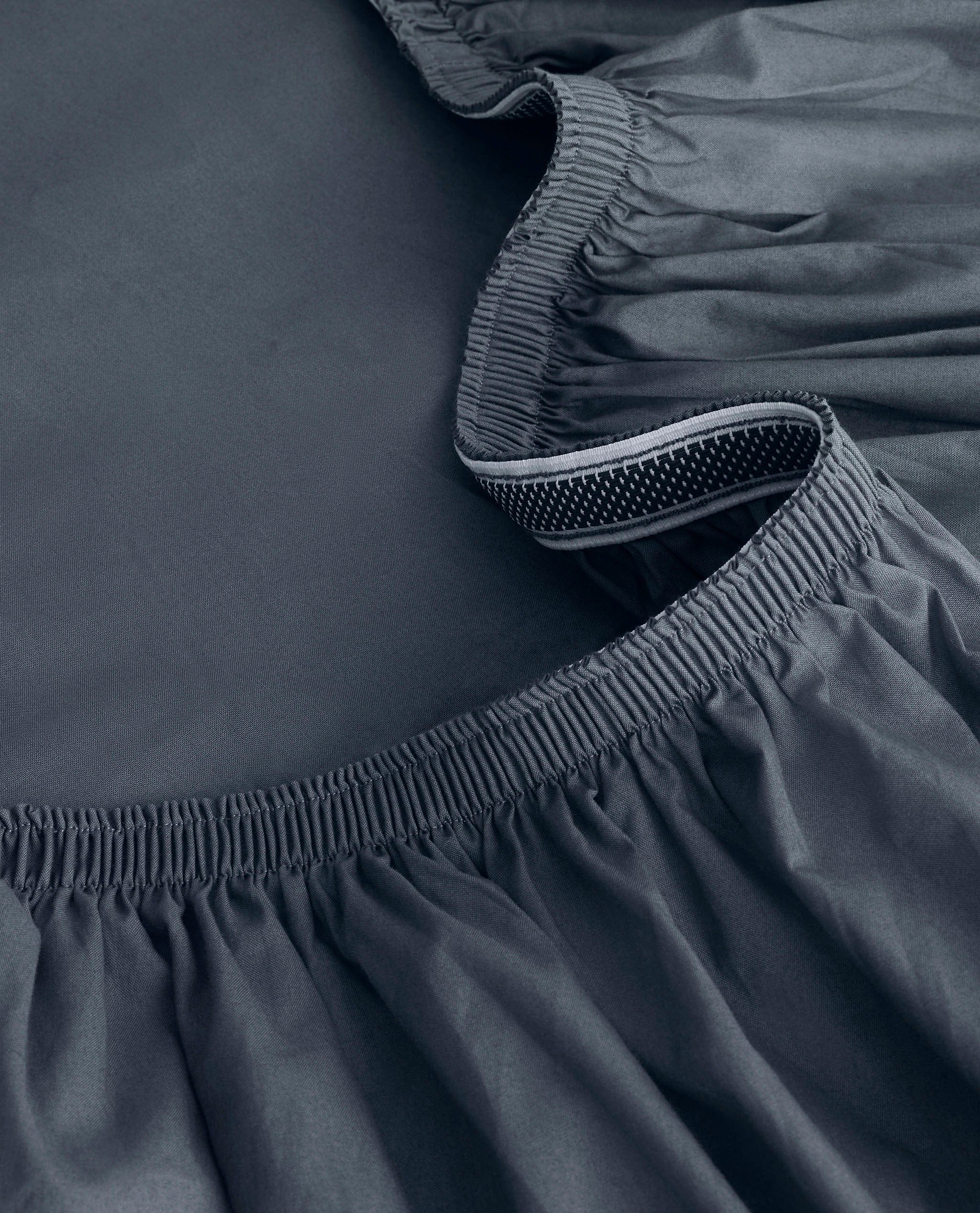 Image 2 of 6 showing Rise & Fall's Soft & Smooth sateen cotton deep fitted sheet in indigo.