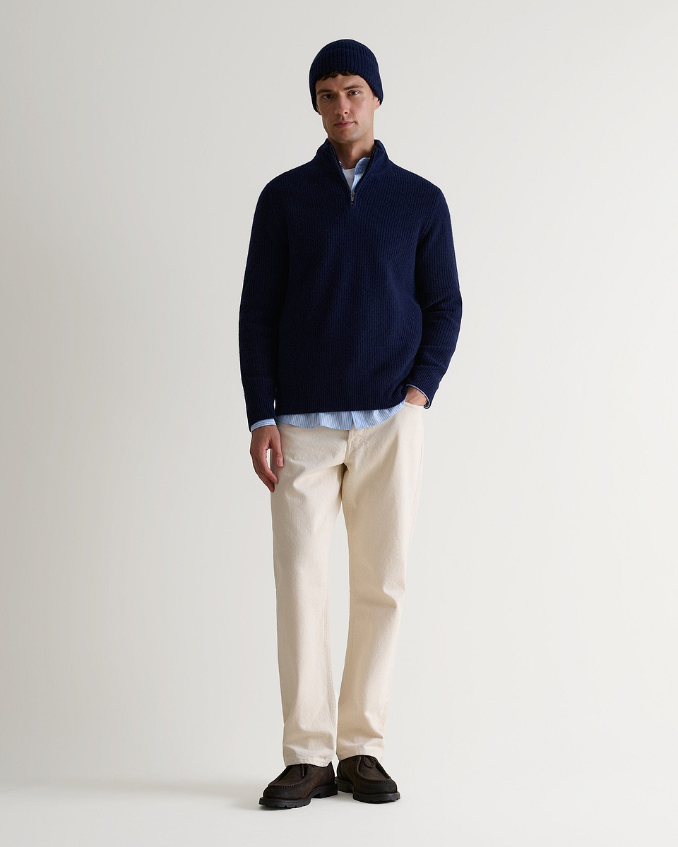 Image 3 of 3 showing man wearing Rise & Fall's Cashmere Merino Ribbed Knit Beanie in navy.