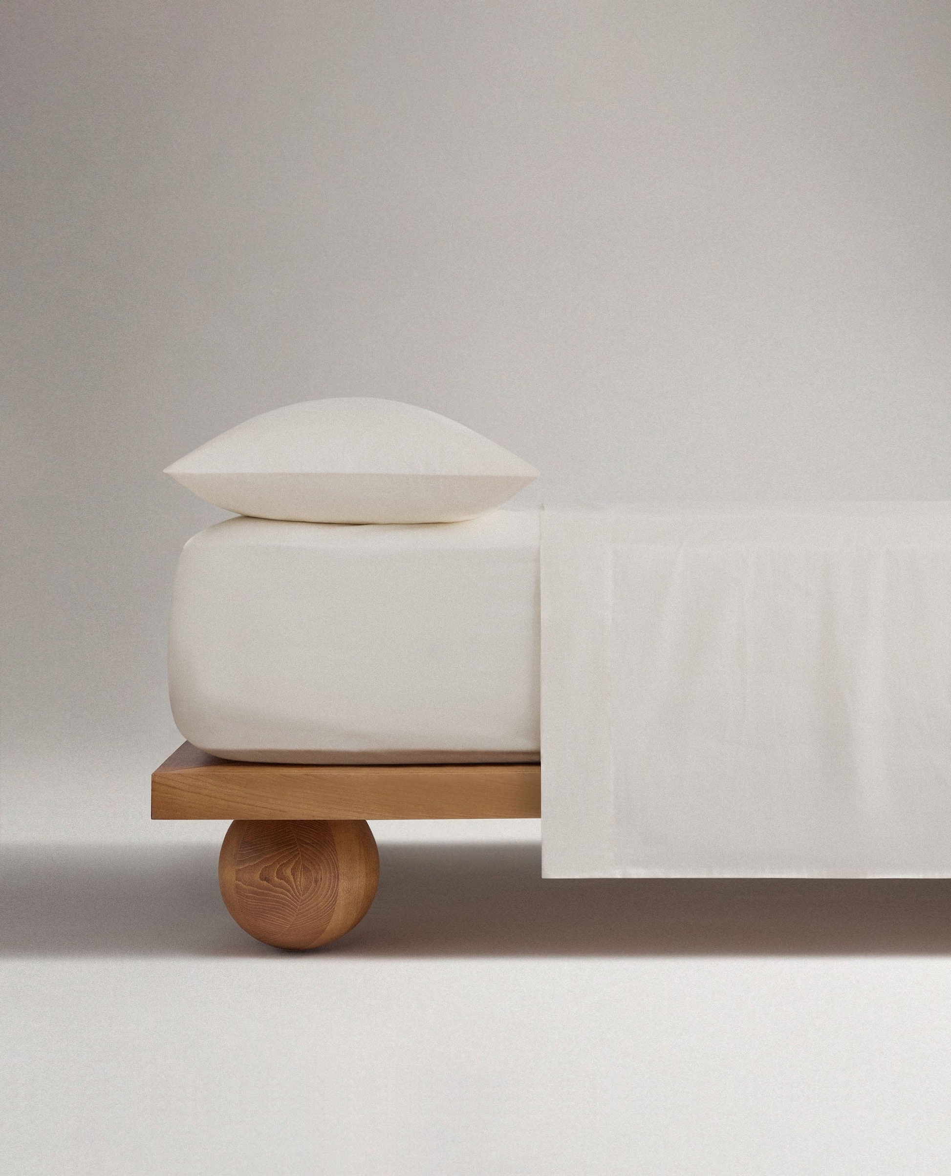 Image 3 of 5 showing Rise & Fall's buttermilk Soft & Smooth sateen cotton deep fitted sheet.