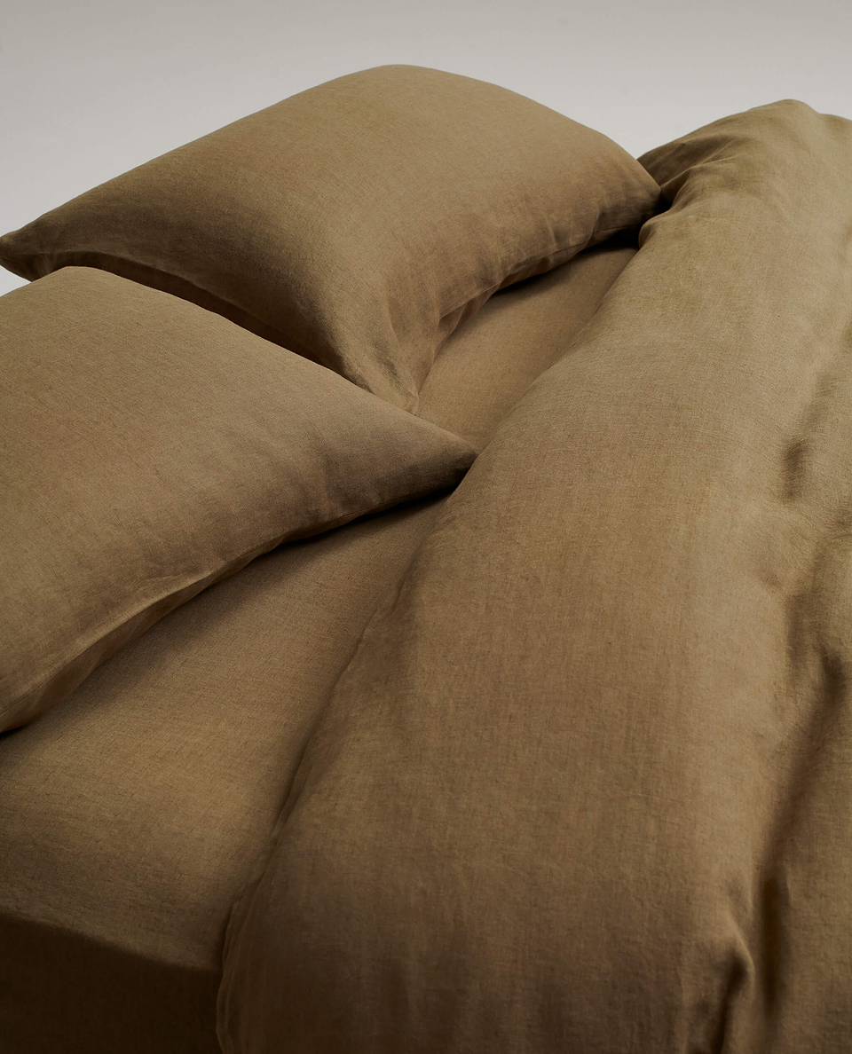 image 3 of 5 showing close up of Rise & Fall's Relaxed & Refined linen duvet set, fabric: European flax, colour: olive