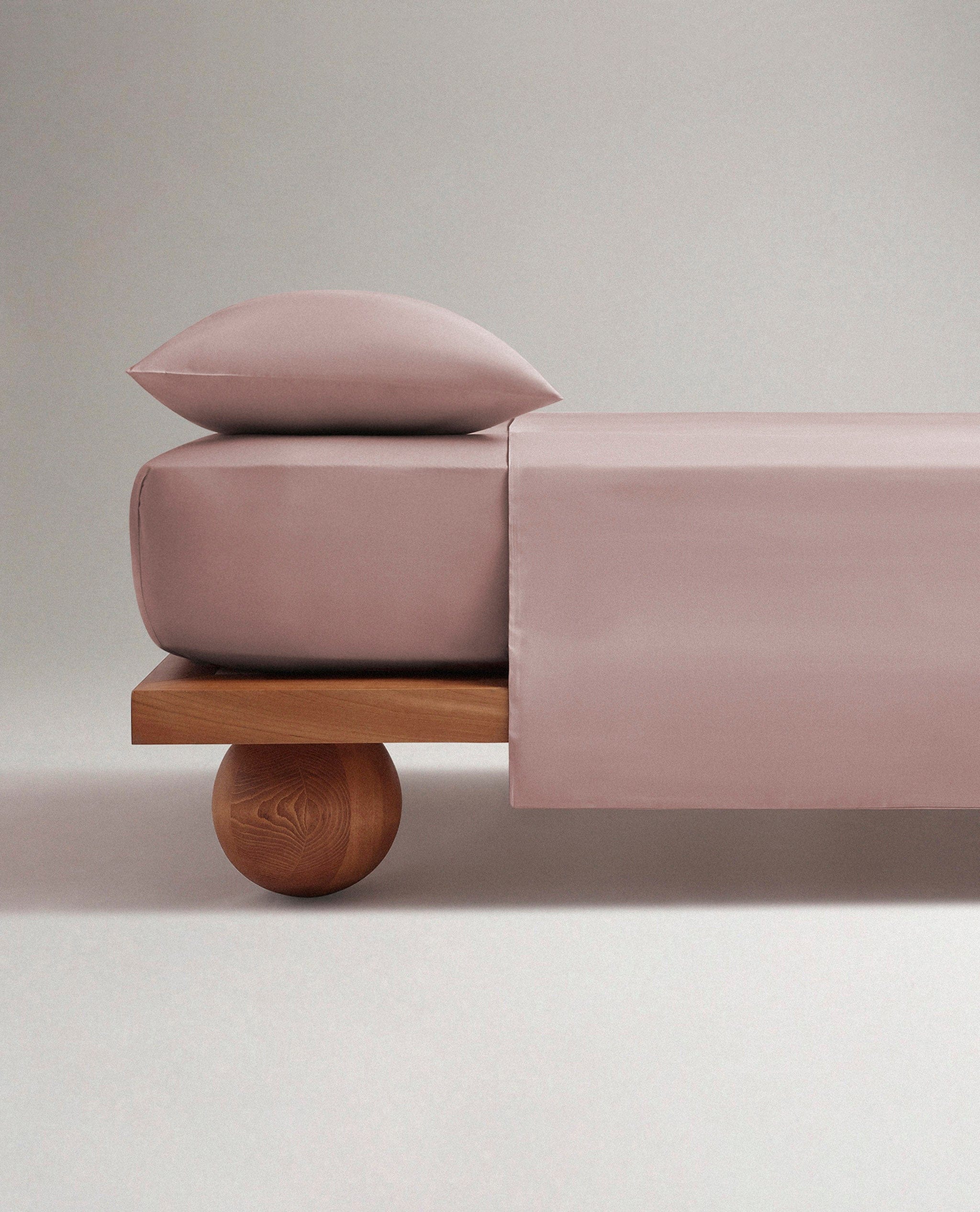 Image 3 of 6 showing bed made with Rise & Fall's Crisp & Cool organic cotton duvet set in clay.