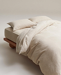 image 3 of 6 showing bed with Rise & Fall's Relaxed & Refined linen duvet set, fabric: European flax, colour: natural