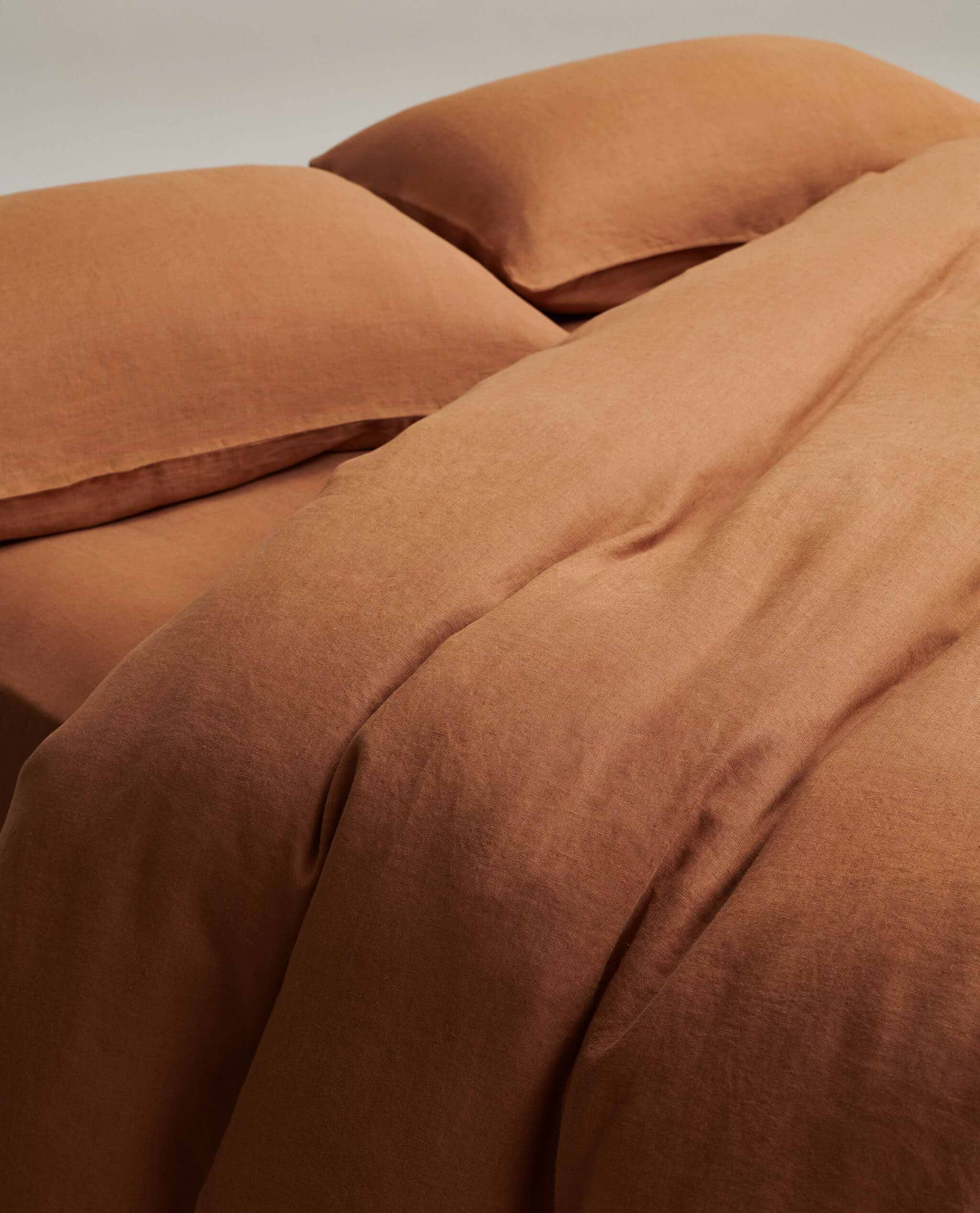 image 3 of 6 showing close up of Rise & Fall's Relaxed & Refined linen duvet set, fabric: European flax, colour: ochre