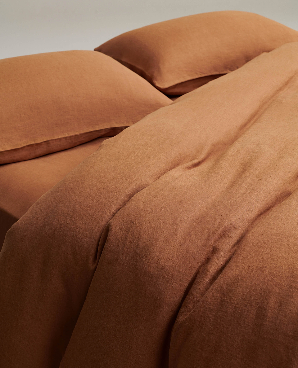 image 3 of 6 showing close up of Rise & Fall's Relaxed & Refined linen duvet set, fabric: European flax, colour: ochre