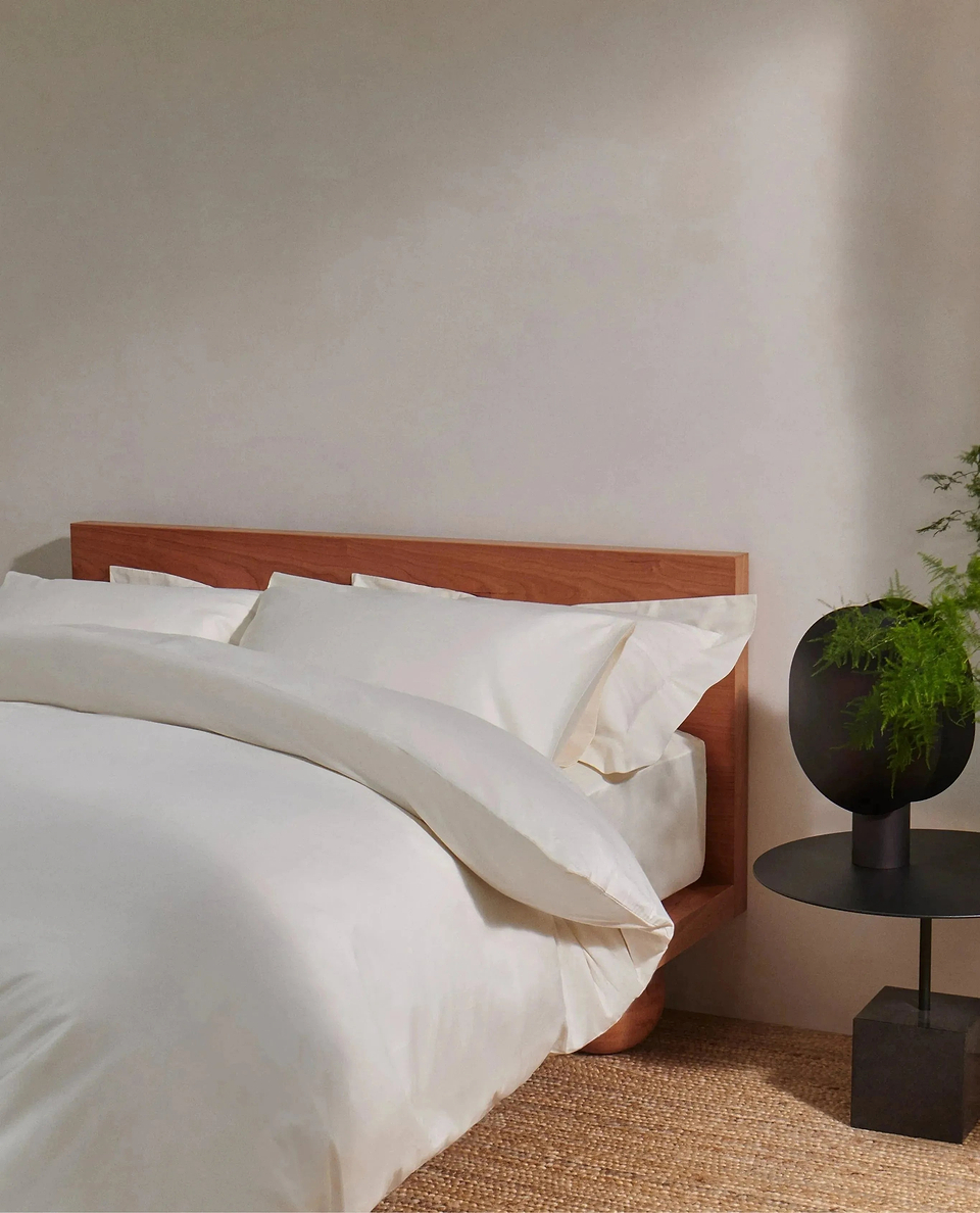 image 4 of 4 showing bed with Rise & Fall's buttermilk crisp & cool duvet set in percale cotton