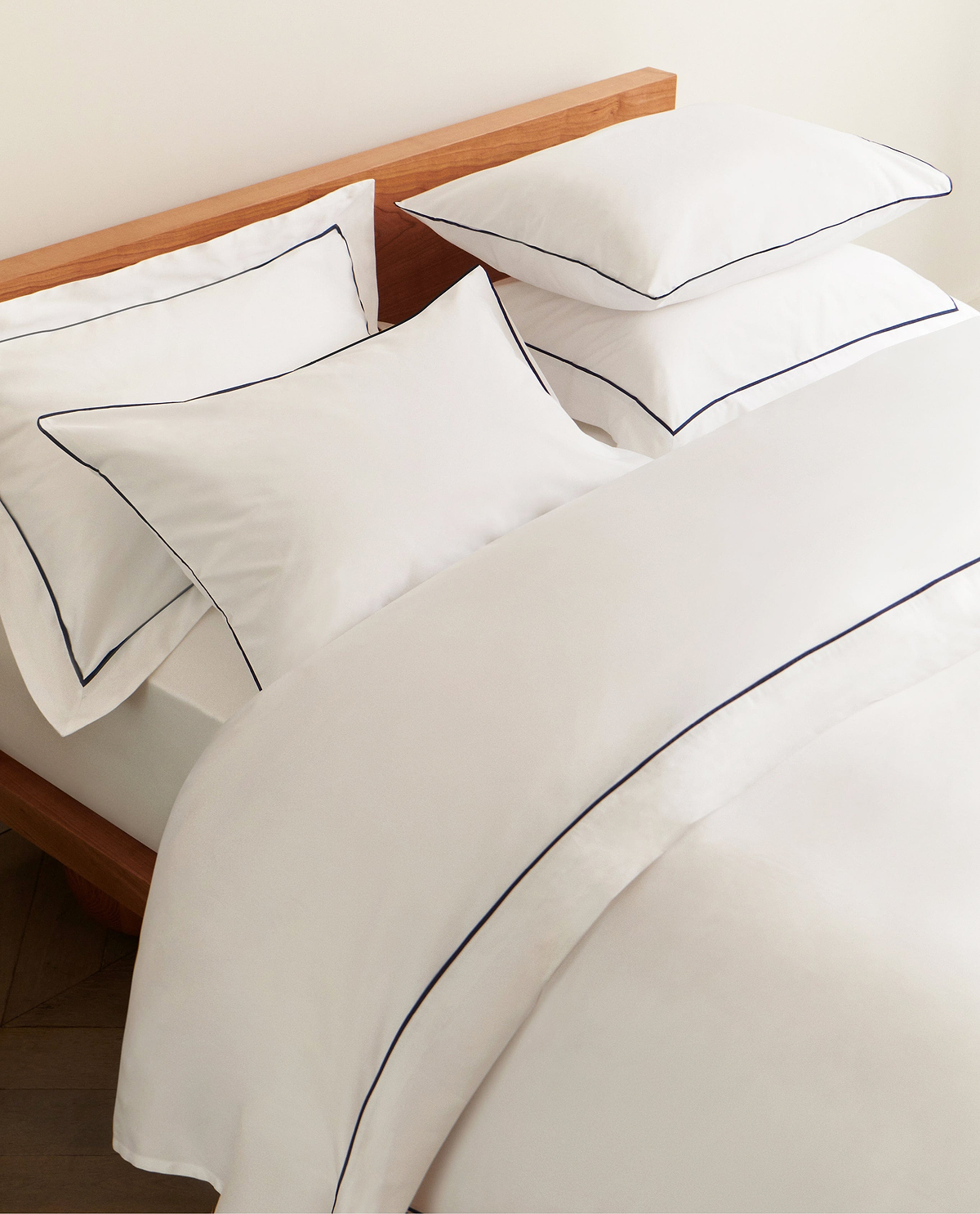Image 4 of 4 showing Rise & Fall's Crisp & Cool Organic Cotton Oxford Pillowcase Set, colour: white navy piping.