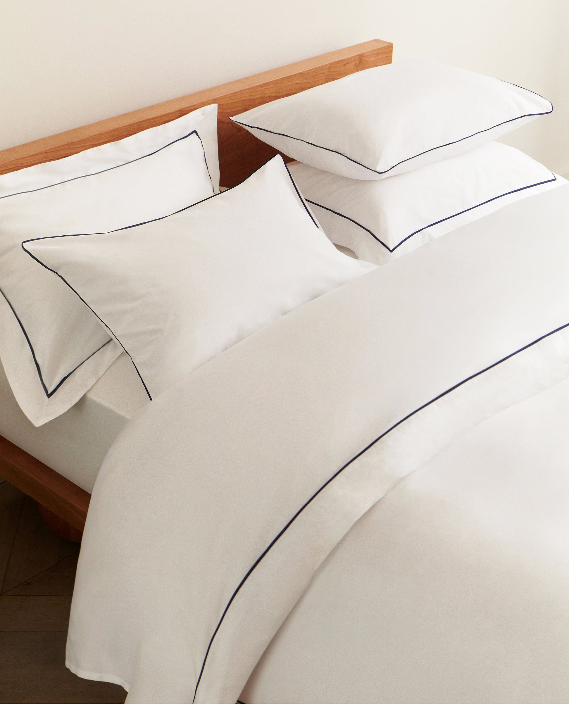 Image 4 of 4 showing Rise & Fall's Crisp & Cool Organic Cotton Oxford Pillowcase Set, colour: white navy piping.