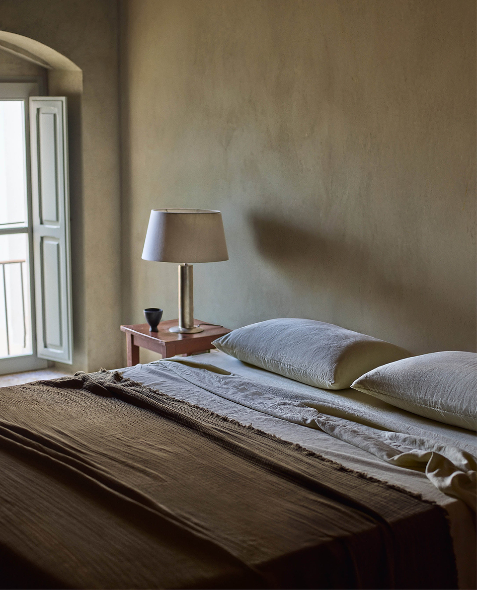 Image 4 of 6 showing Rise & Fall's Relaxed & Refined linen duvet set in pale peach.