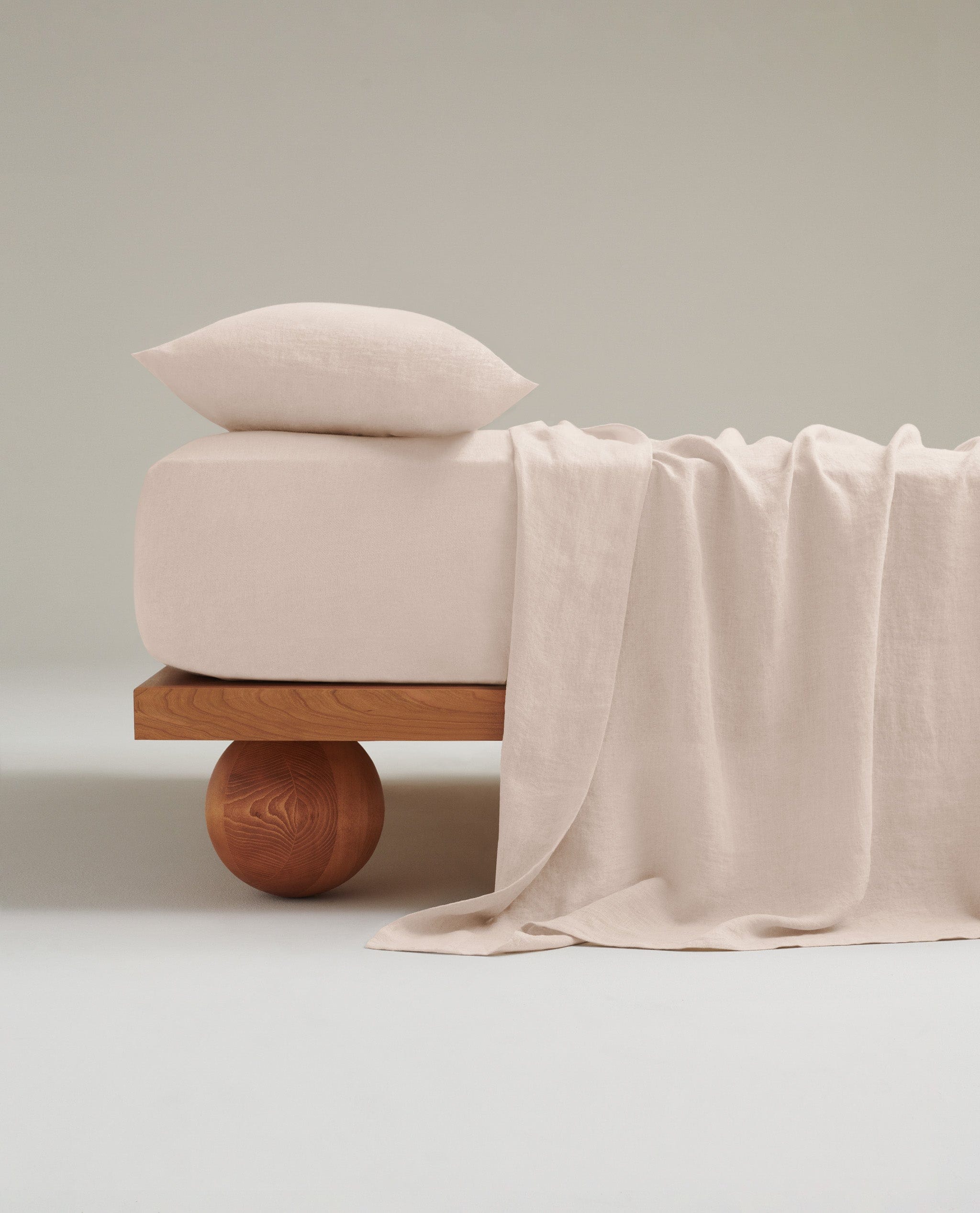 Image 5 of 8 showing Rise & Fall's Relaxed & Refined European flax™ linen fitted sheet in peach.