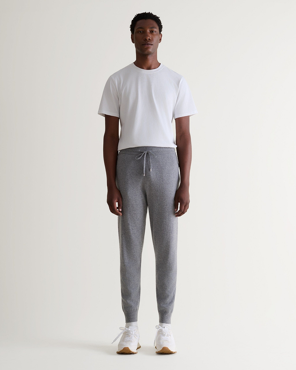 Image 6 of 6 showing man wearing Rise & Fall's fine cashmere joggers, grey.