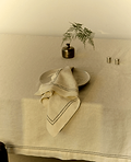 Linen tablecloth and napkins on a table. 