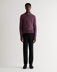 Full length view of man wearing Rise & Fall's finest cashmere 1/4 zip jumper in Smoky Lilac. Paired with black trousers.