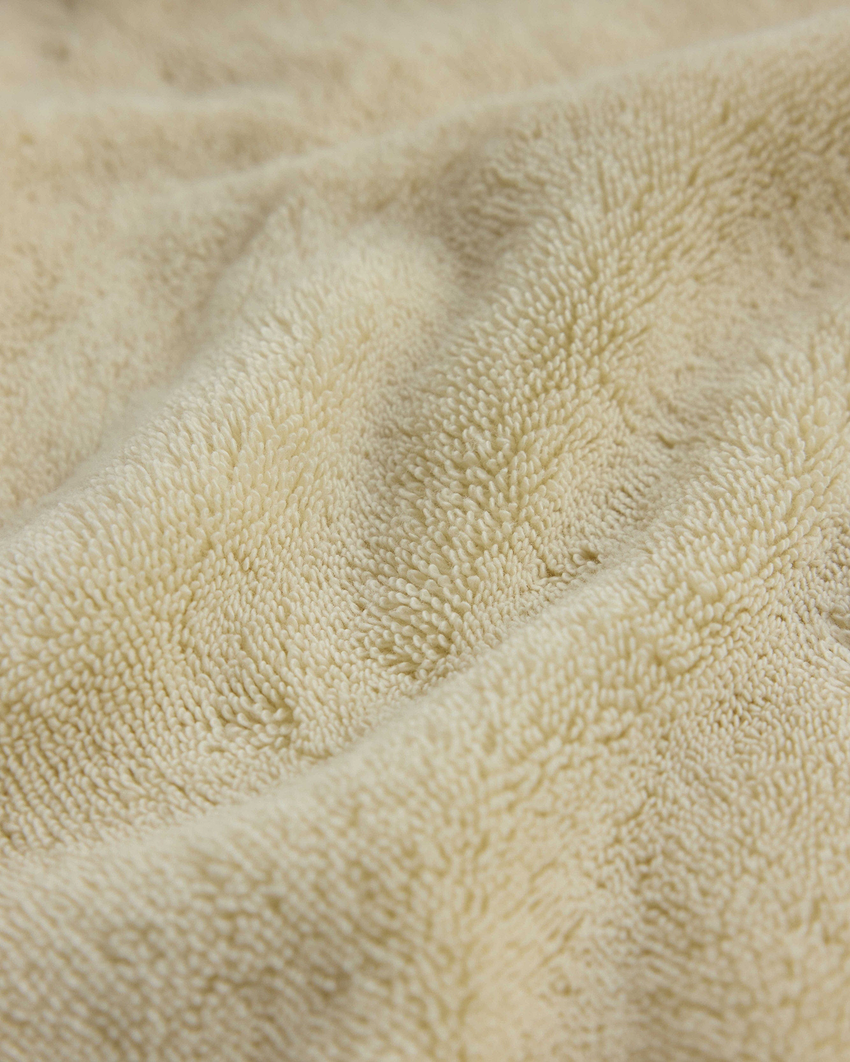 Close up of Rise & Fall's buttermilk Turkish Aegean cotton towel
