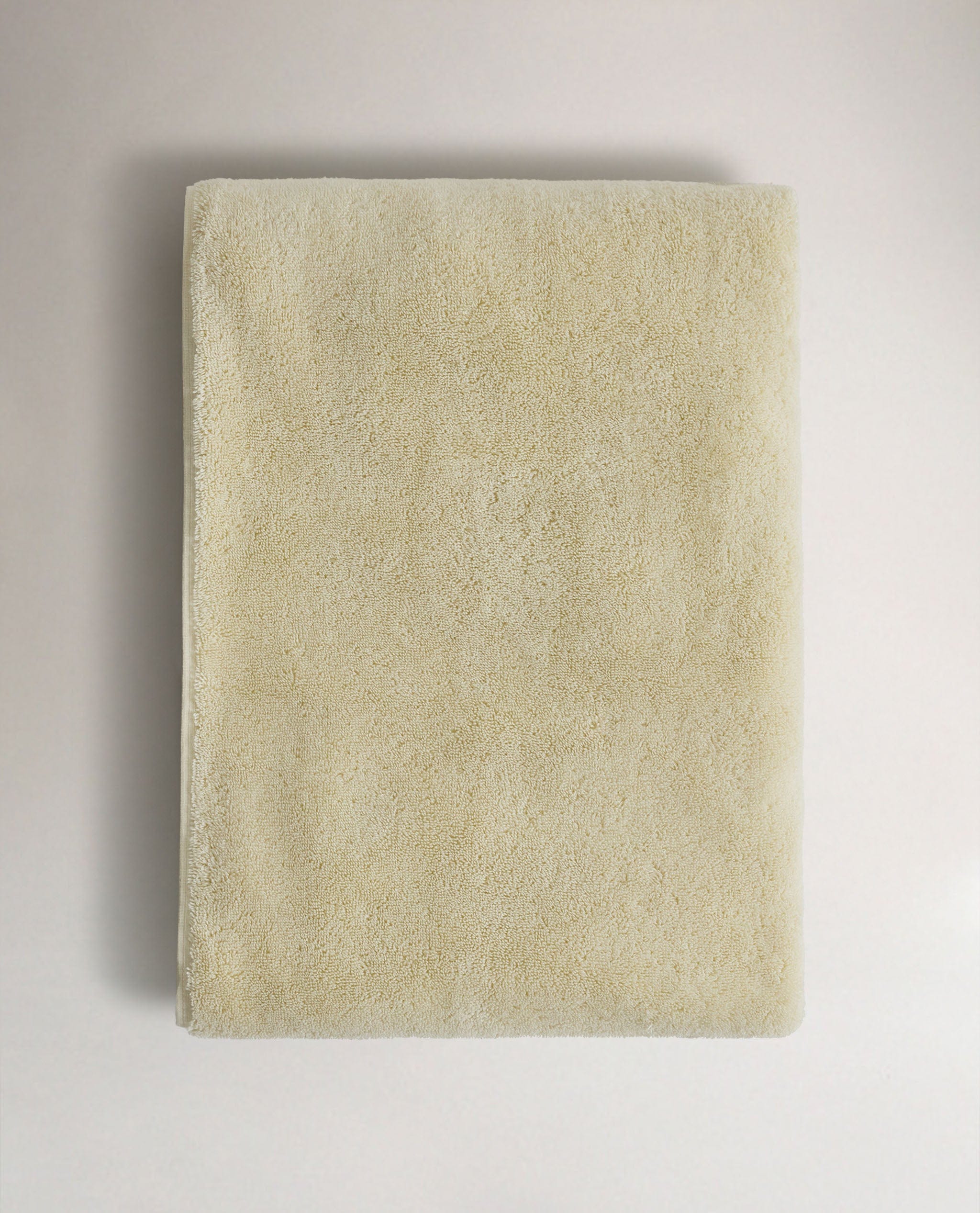 Top view of Rise & Fall's buttermilk ultra-absorbant Turkish cotton bath towel