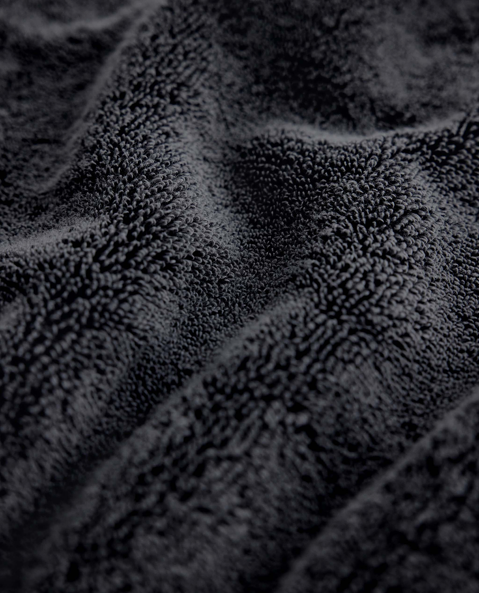 Close up of Rise & Fall's charcoal Turkish Aegean cotton towel