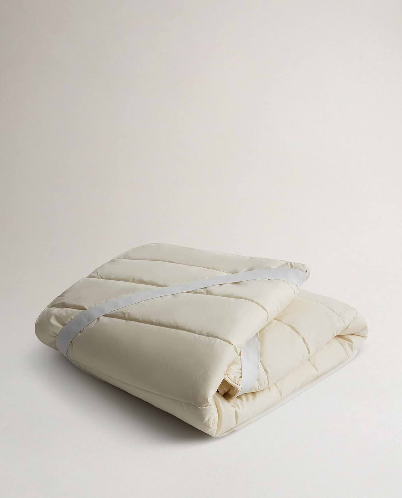 Rise & Fall's Luxury British Wool Matress Protector folded up.