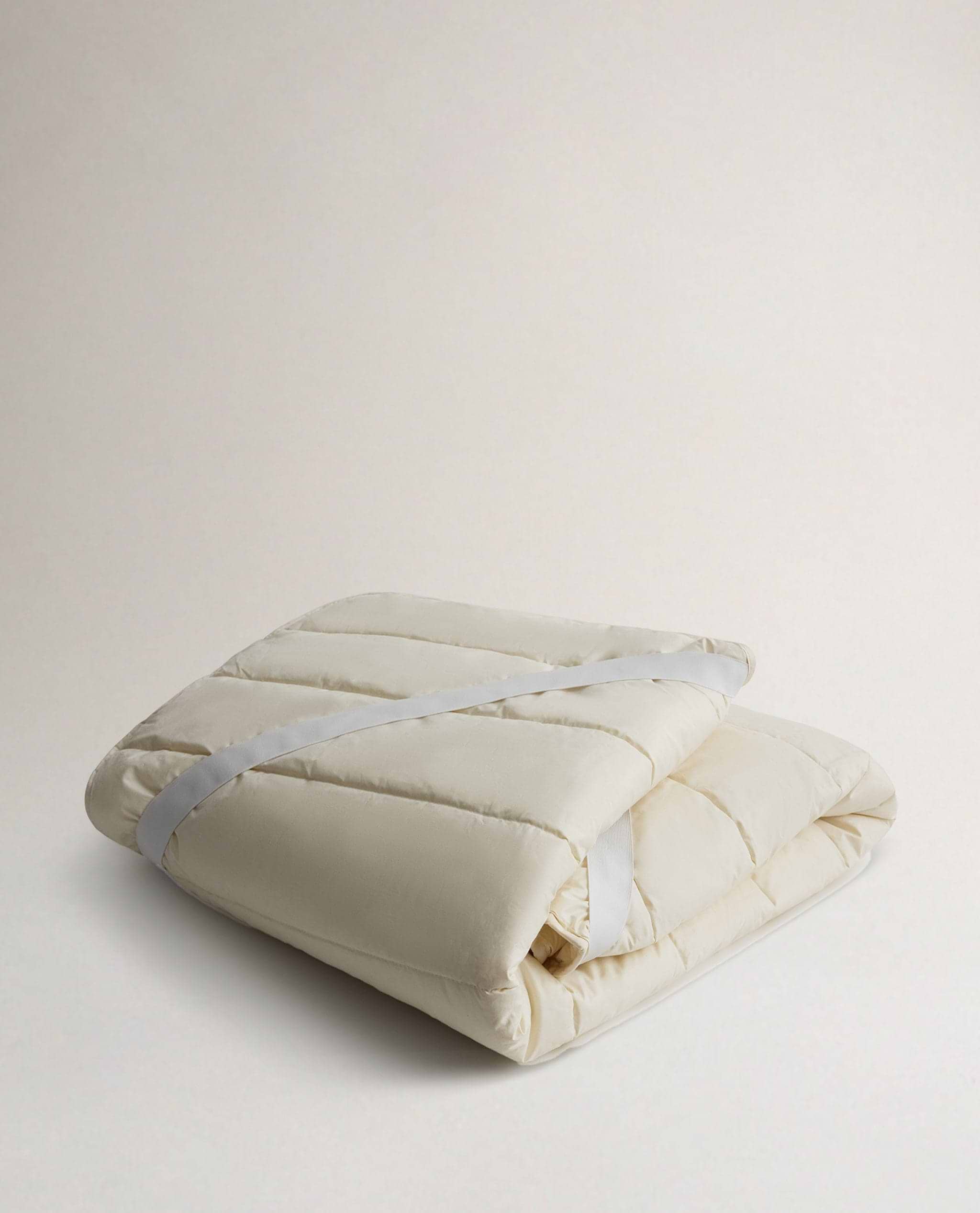 Rise & Fall's Luxury British Wool Matress Protector folded up.