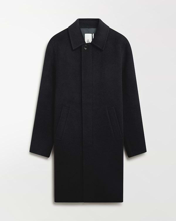 Close up of Rise & Fall's navy cashmere merino double-faced wool coat.