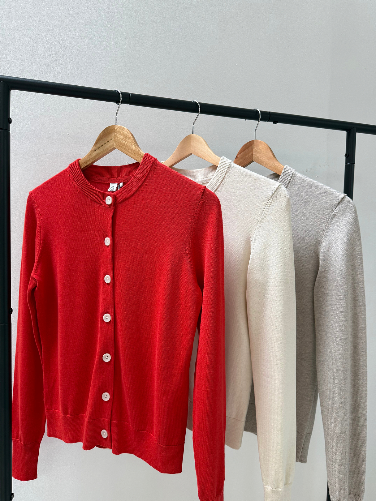 Silk-cotton cardigans in red, cream and light beige.