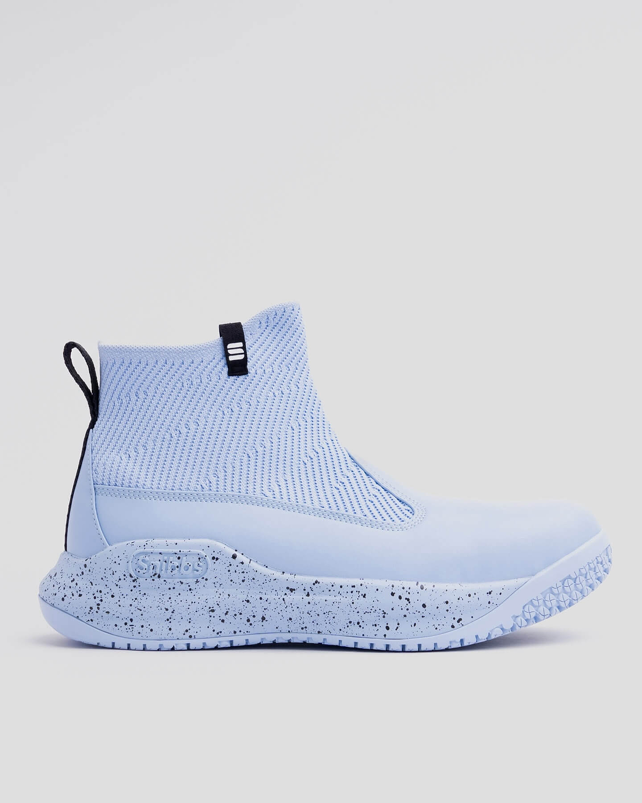 Black ankle-high shoe with textured fabric and rubber sole on a gray background.