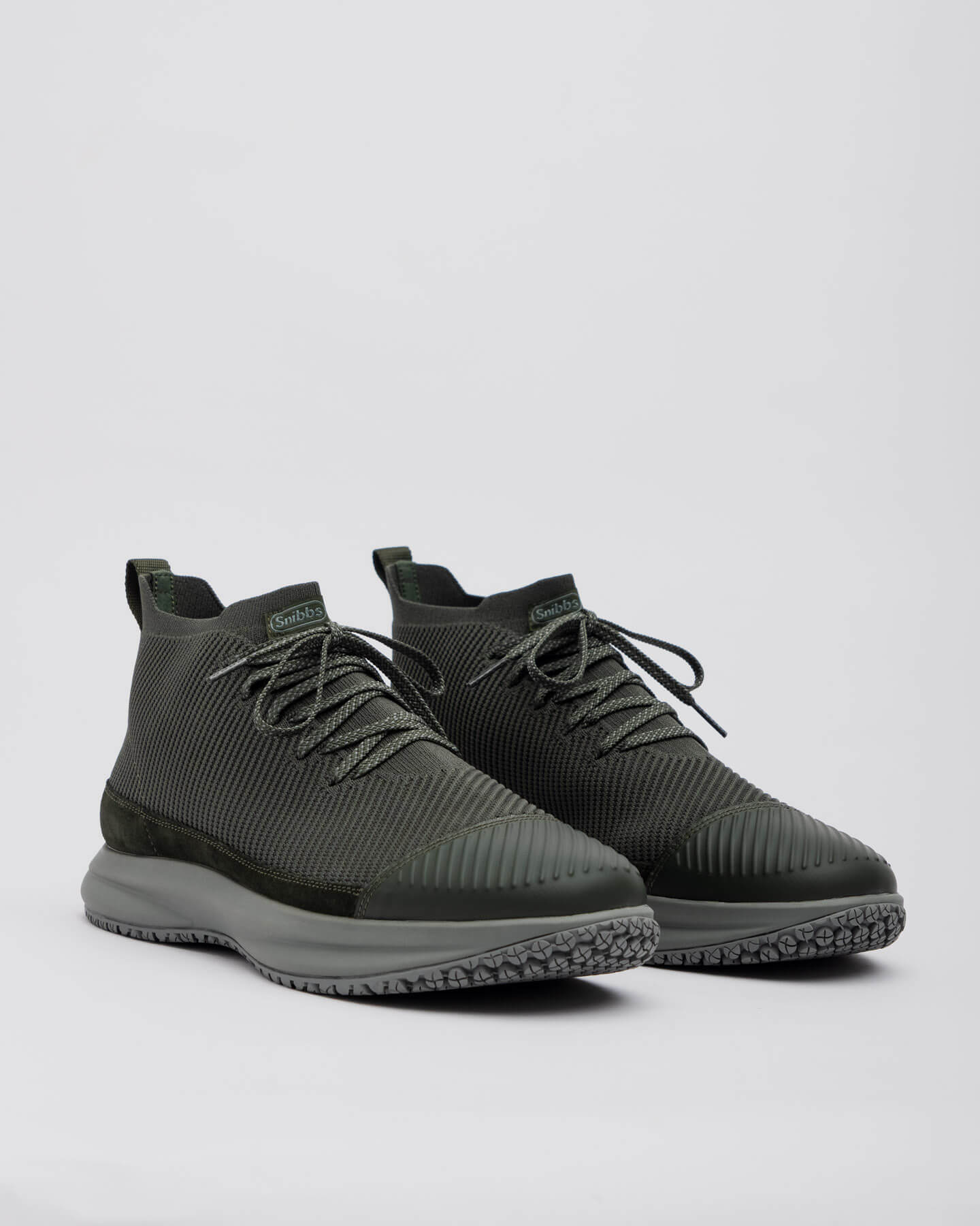 Snibbs ROVR Mid - Climbing Ivy: dark green high-tops with mesh uppers, black laces, and slip-resistant soles on a grey background.