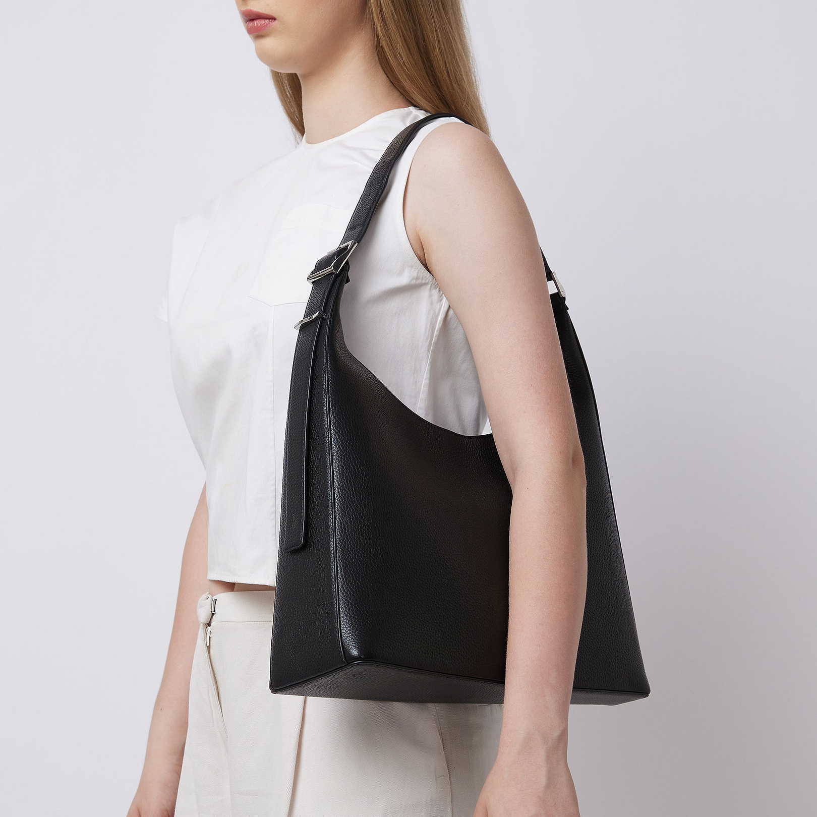 Large Danny Flatiron Pebble Leather Shoulder Bag in Black