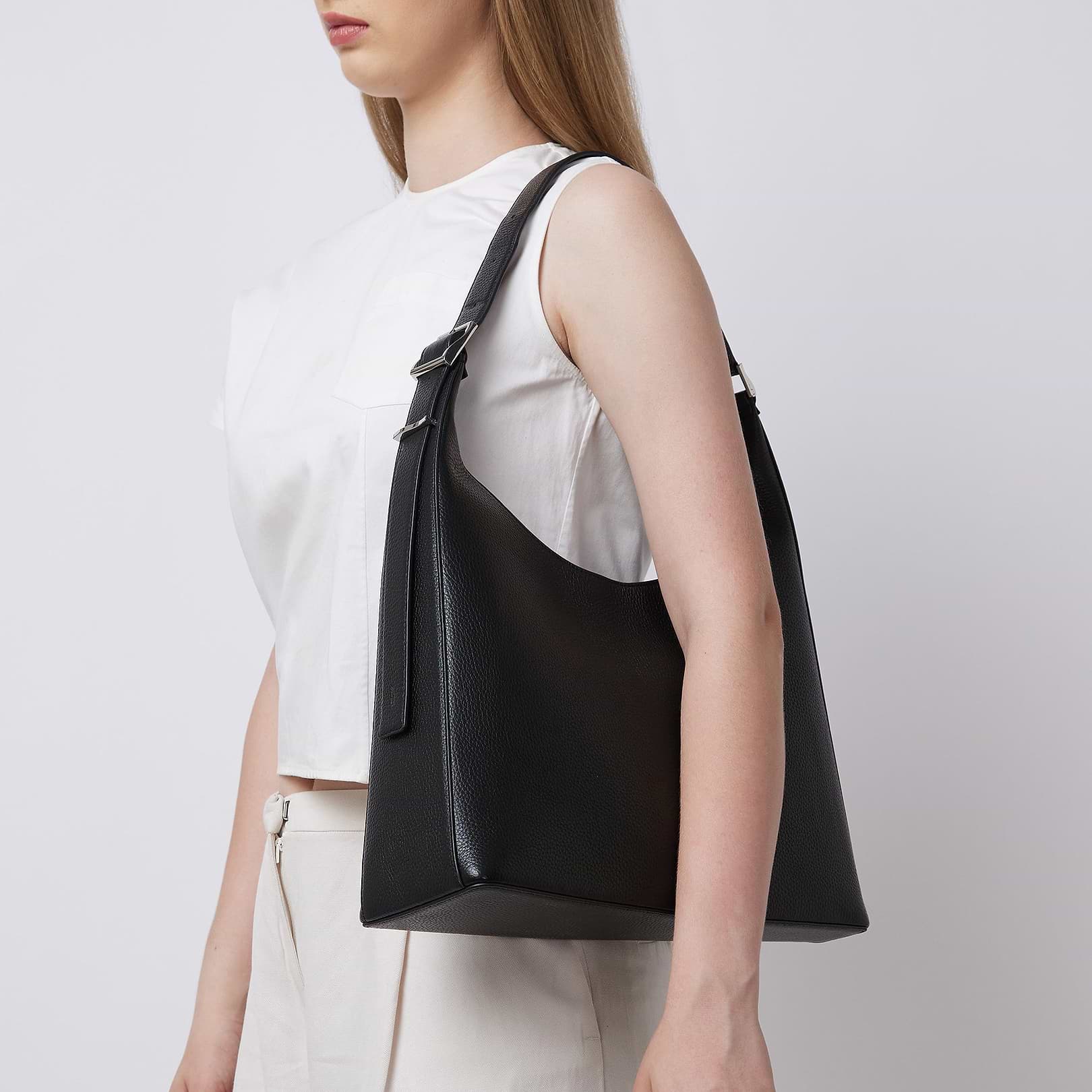 Large Danny Flatiron Pebble Leather Shoulder Bag in Black