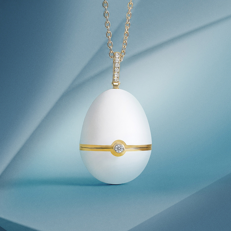 Fabergé №1 Matt White Enamel Egg Pendant Locket in 18 karat yellow gold featuring hand-painted matt white enamel and brilliant-cut diamonds, inspired by the first Imperial Egg of 1885.