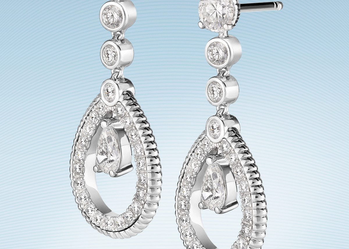 Love Collection 18 karat white gold drop earrings featuring a fluted design with brilliant-cut diamonds, showcasing timeless luxury fine jewellery craftsmanship.