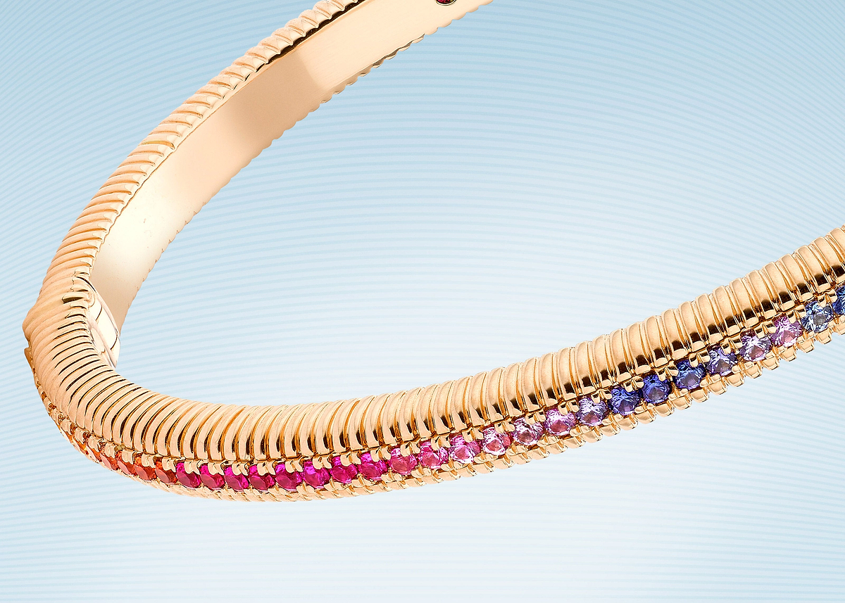 Love Collection 18 karat rose gold bracelet featuring a fluted design adorned with a vibrant gradient of gemstones.