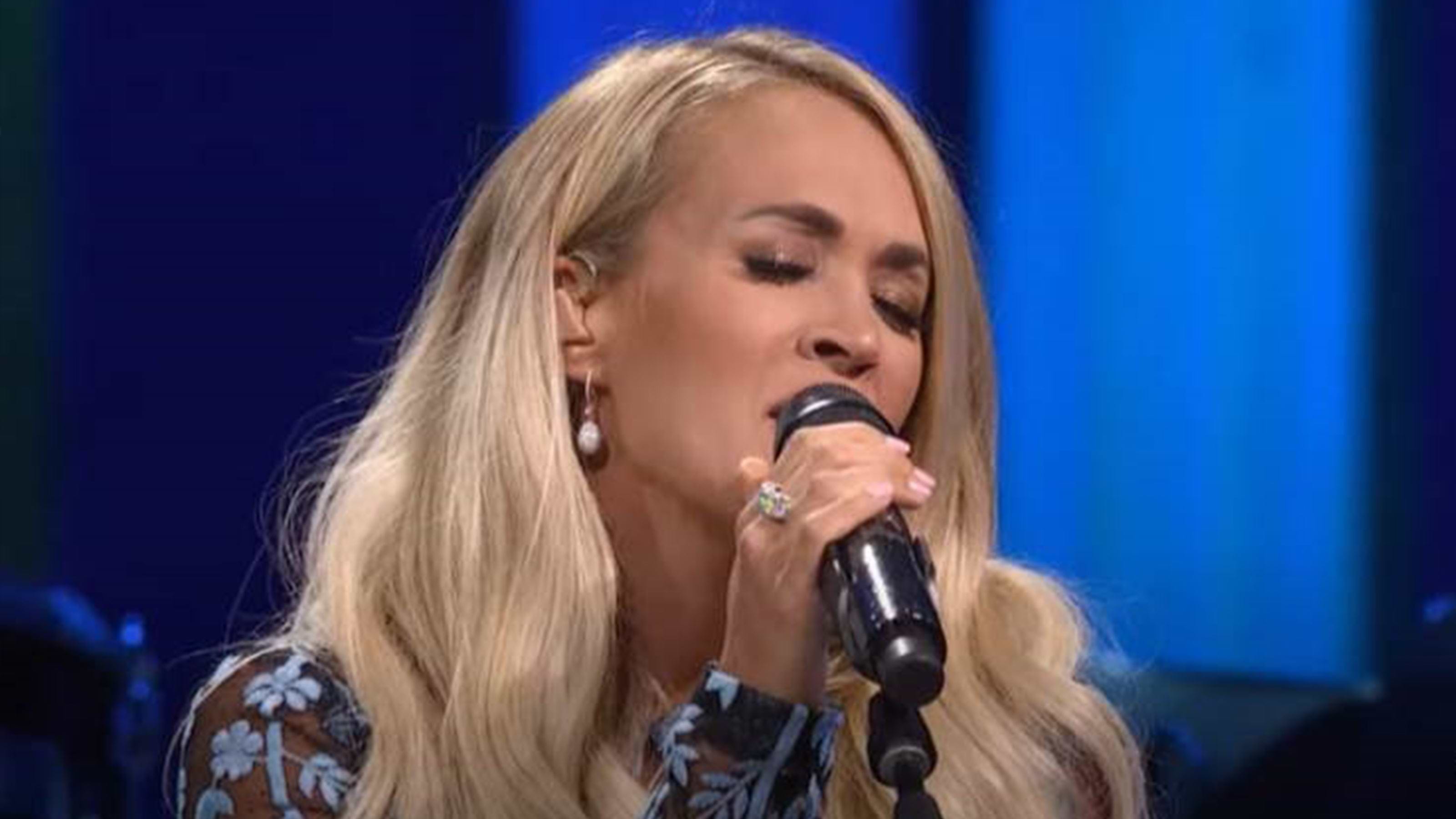 Carrie-Underwood-wears-the-Emotion-Diamond-Hoop-Drop-Earrings-and-Emotion-Diamond-Thin-Ring-performing-Grand-Ole-Opry