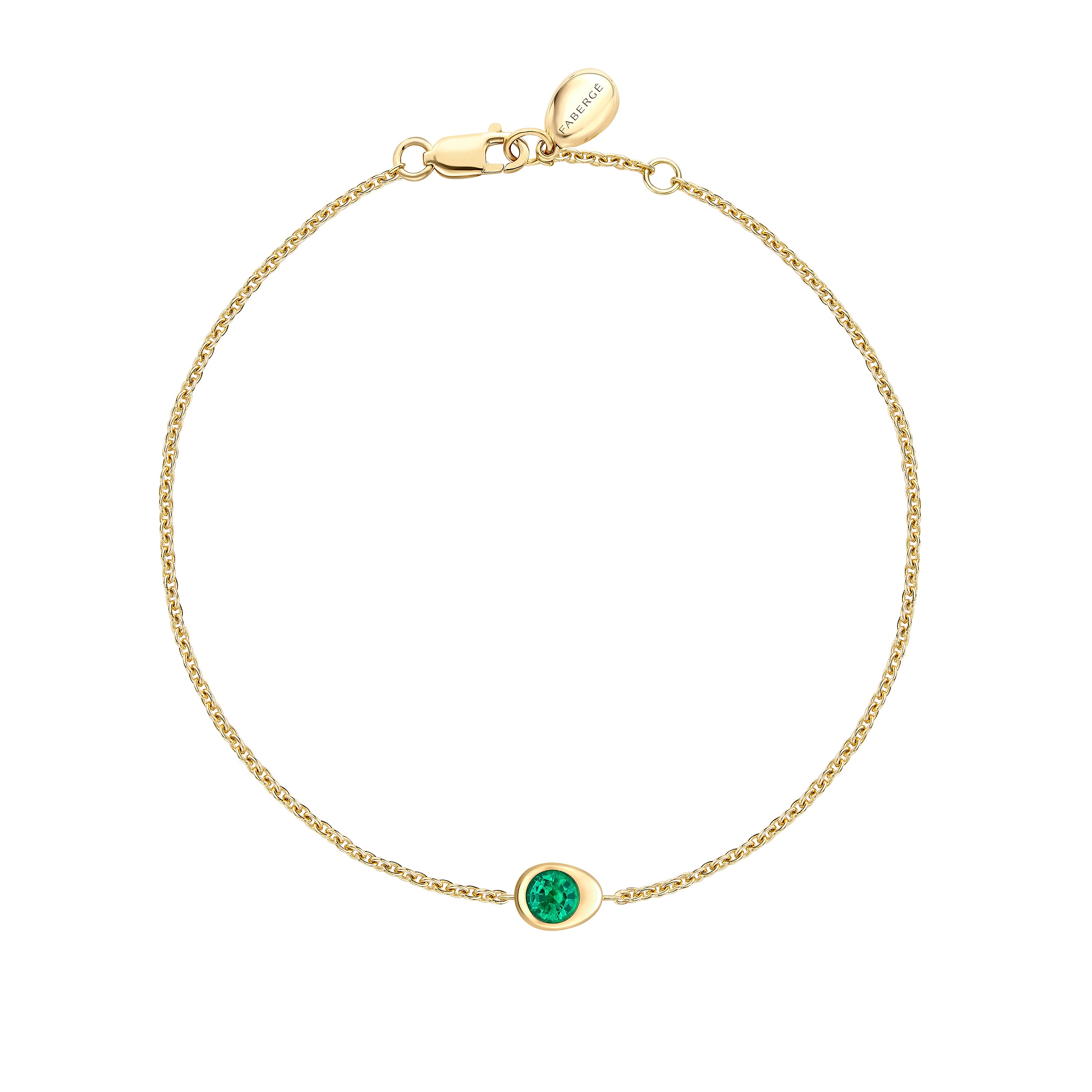 Fabergé gold and emerald bracelet on a white background