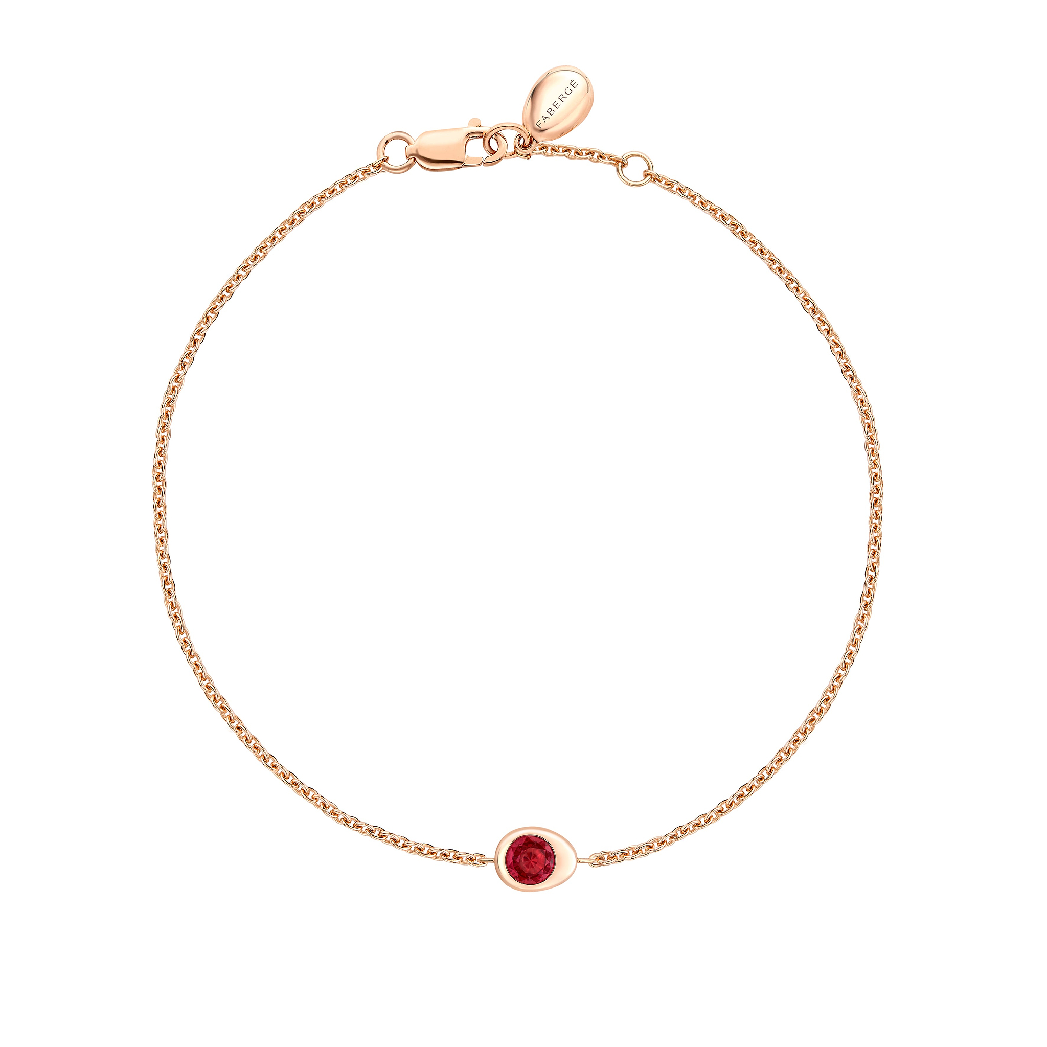 Fabergé gold and ruby bracelet on a white background