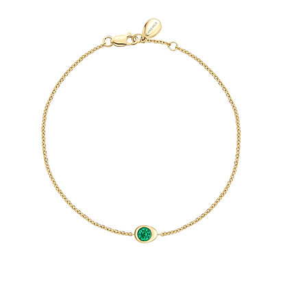 Fabergé gold and emerald bracelet on a white background