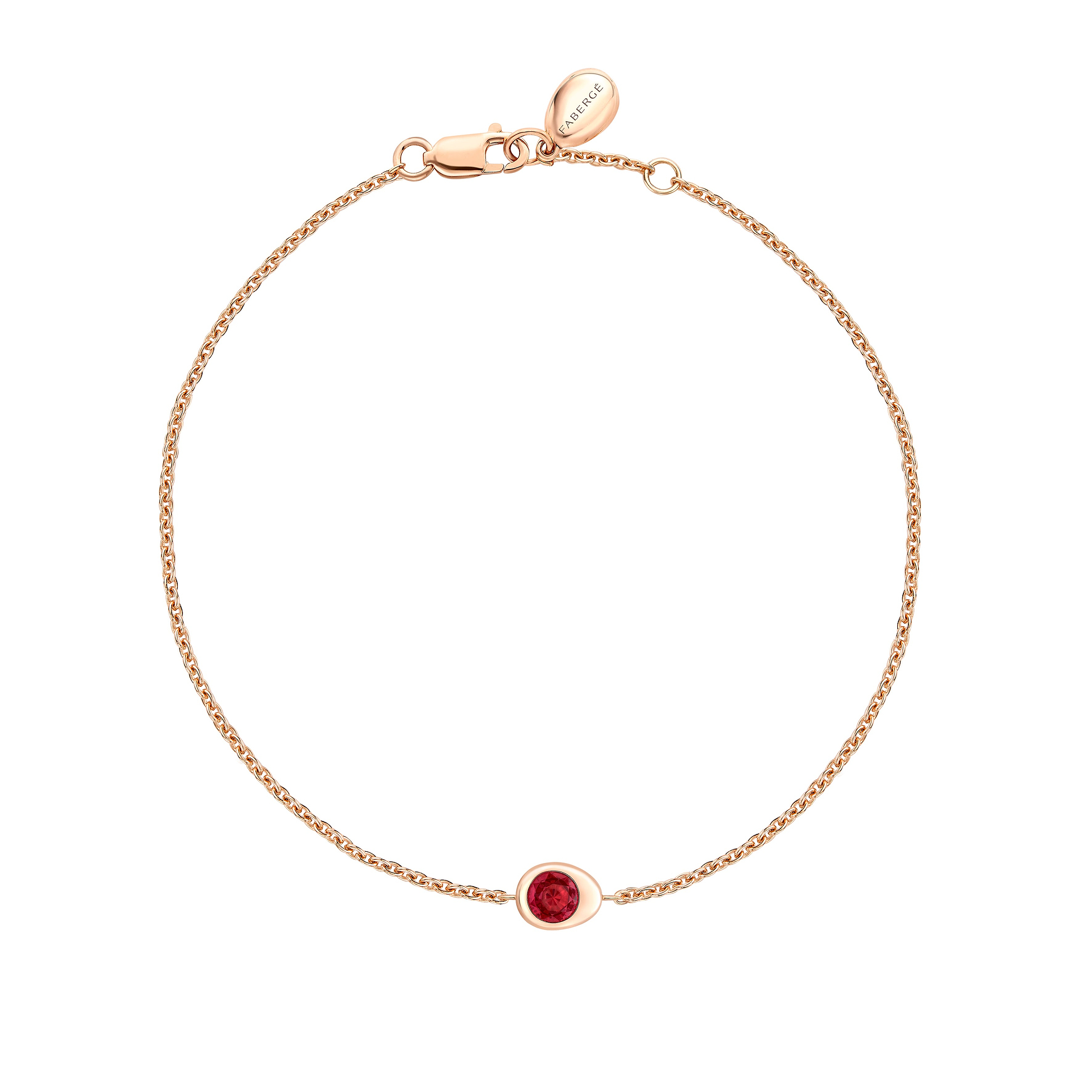Fabergé gold and ruby bracelet on a white background