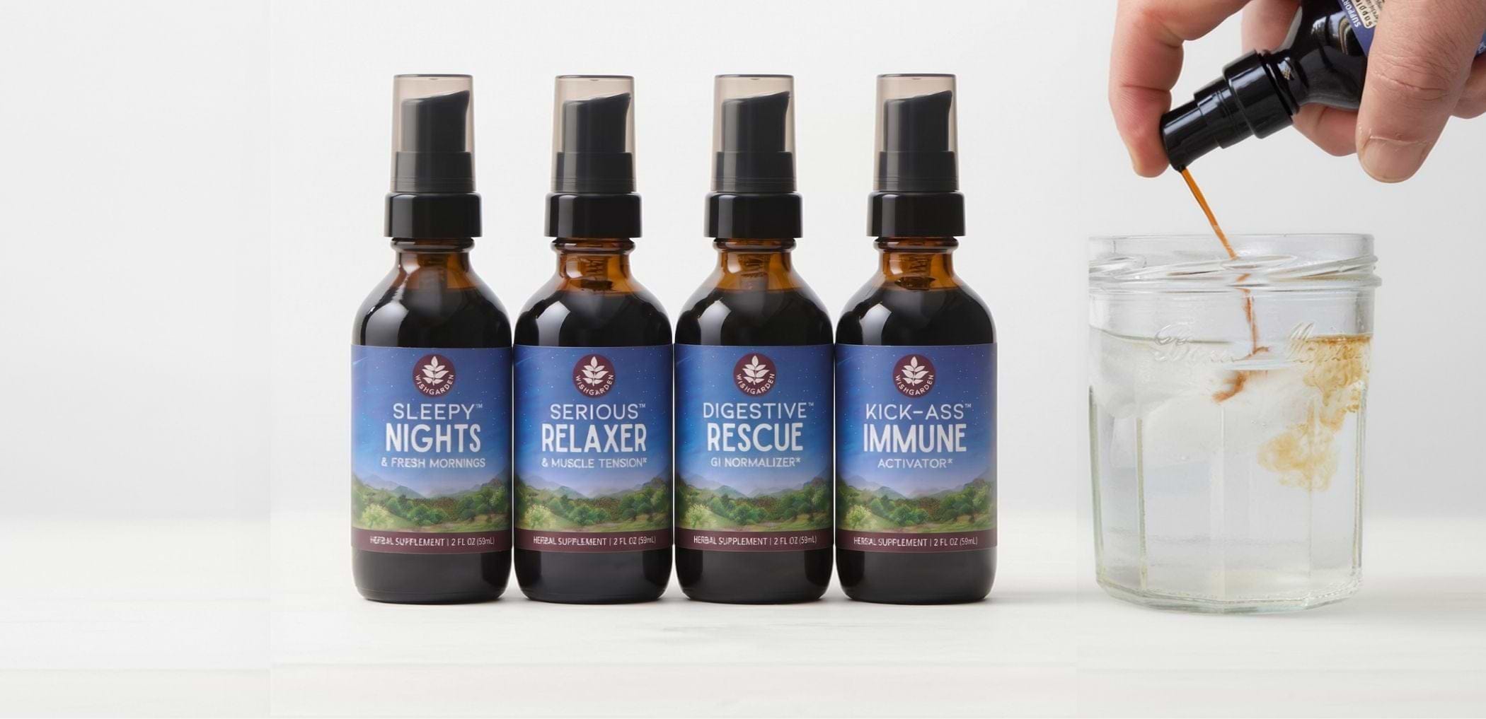 Assortment of 5 tinctures with one tincture being squirted into water