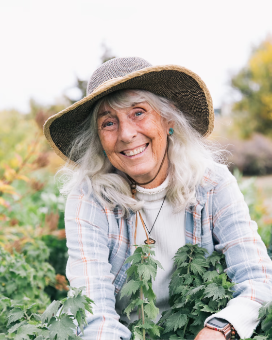 Catherine Hunziker, master herbalist and founder, in an herb garden