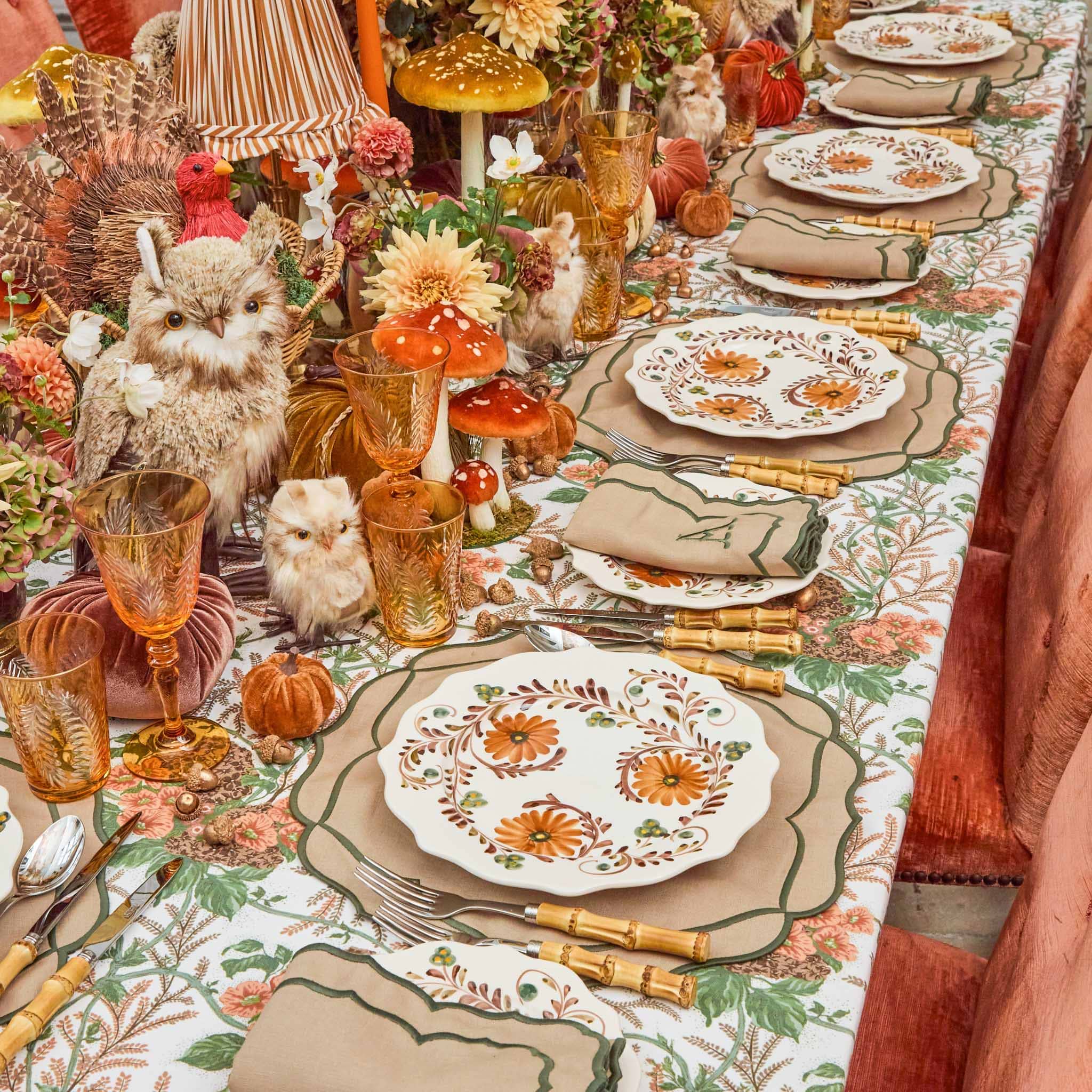 Decorative table setting with fall-themed plates, glasses, and centerpieces. Bamboo Cutlery