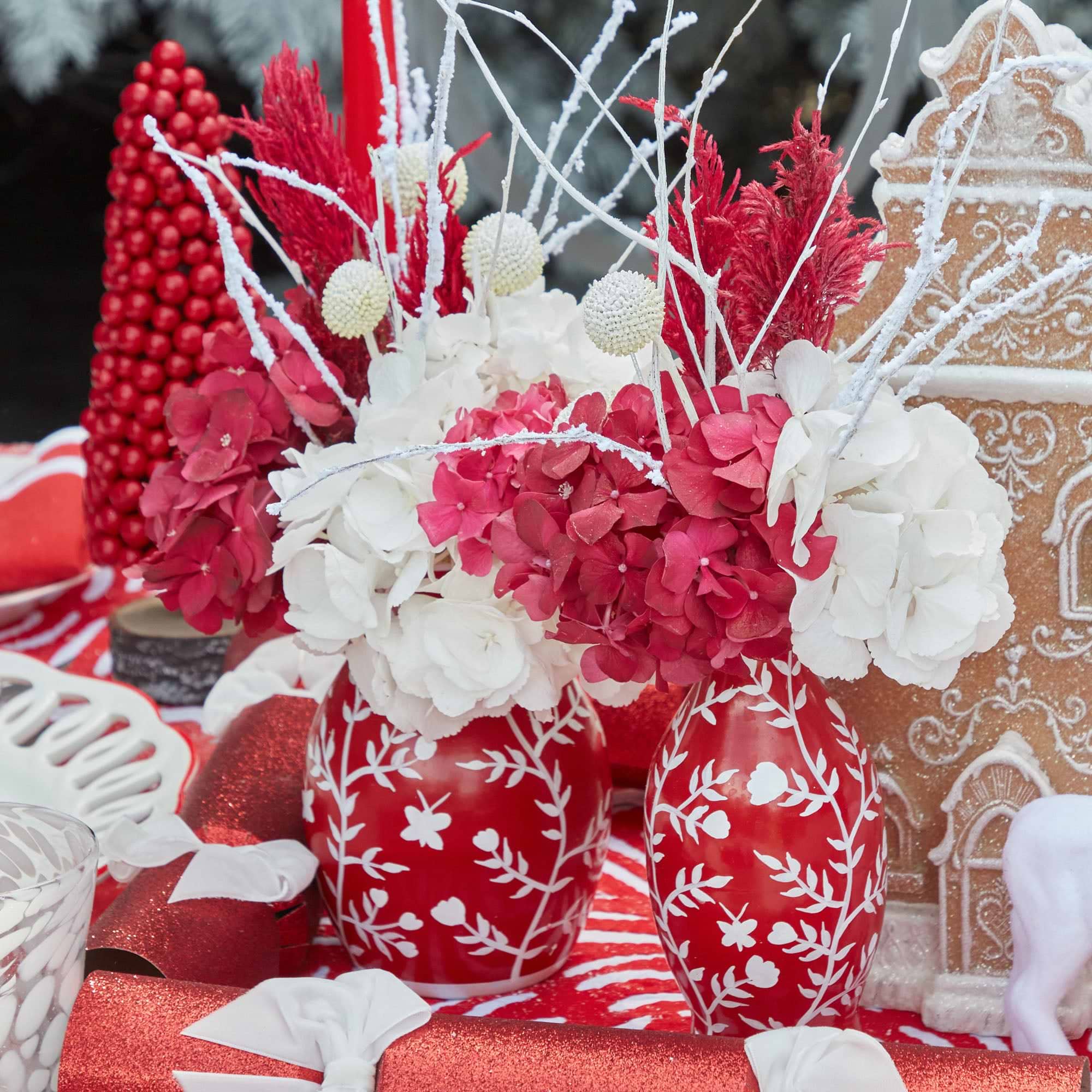 Create a stunning centerpiece with the Set of 3 Red Hand Painted Tole Bud Vases.
