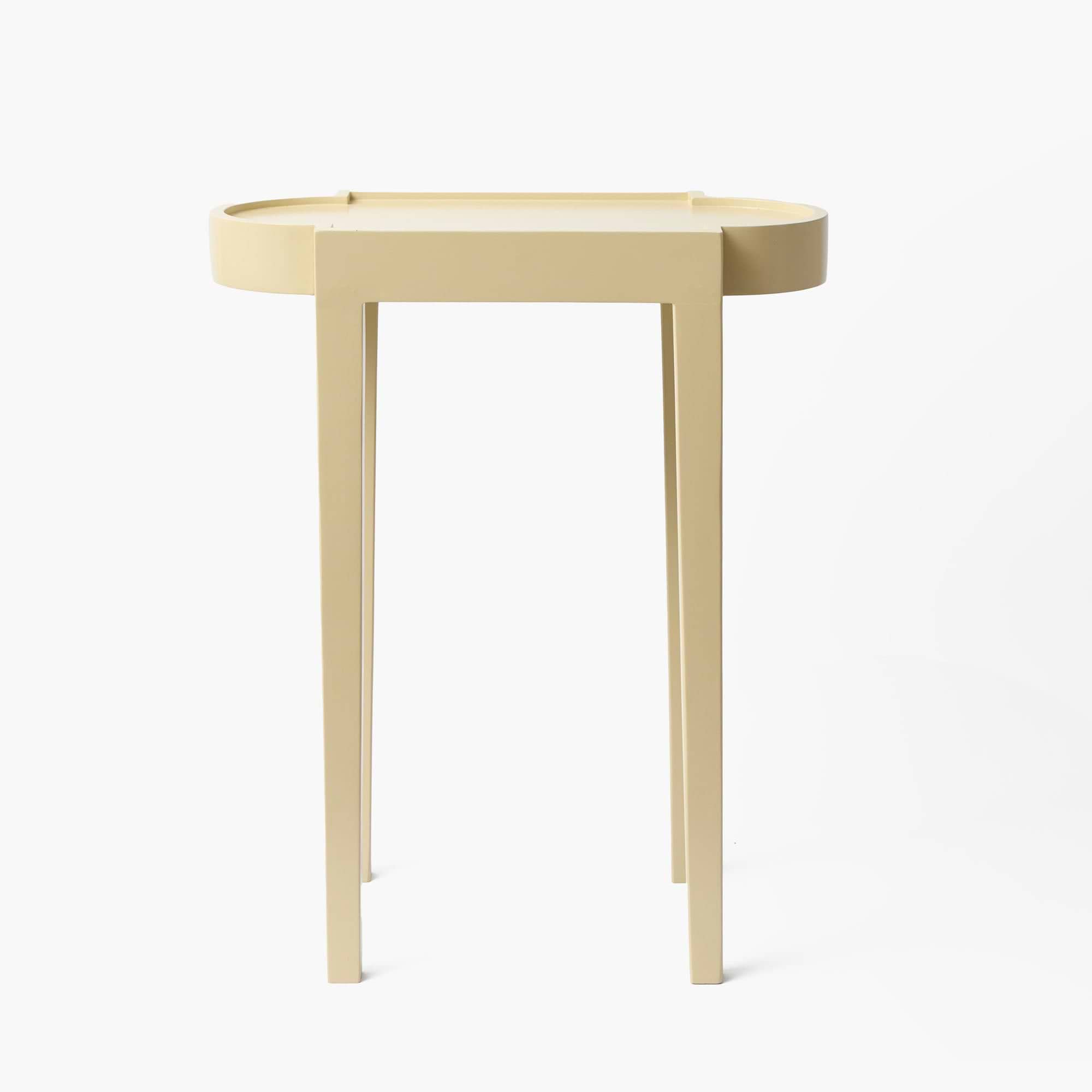 Beige side table on a white background