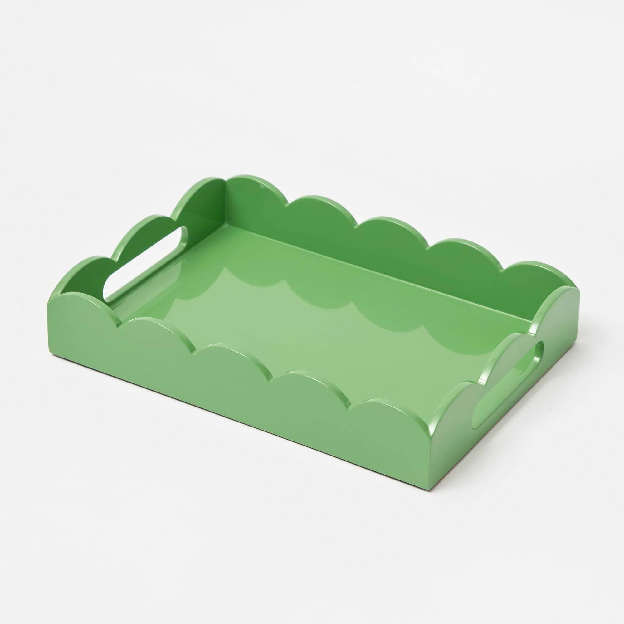 Green scalloped-edge tray on a white background