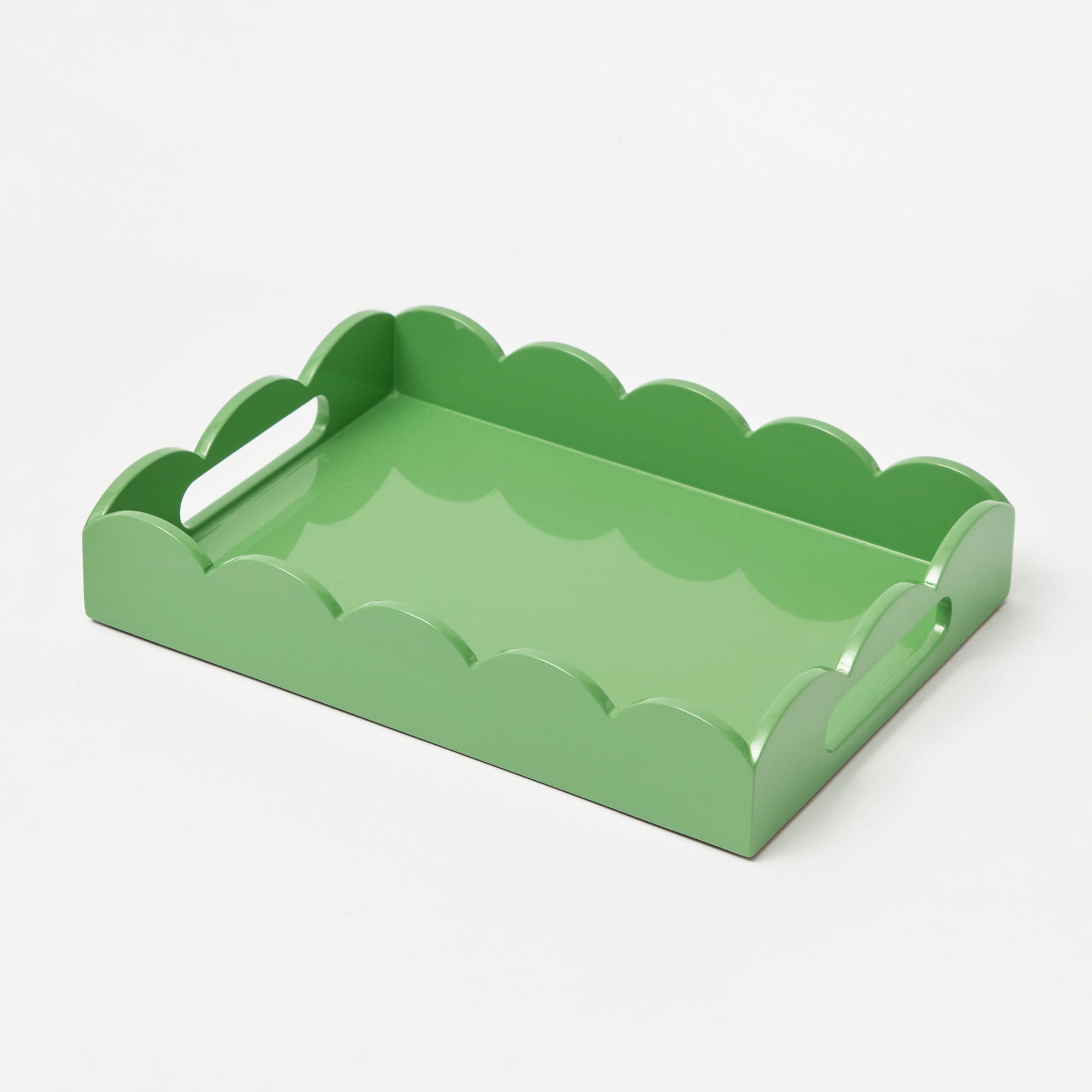 Green scalloped-edge tray on a white background